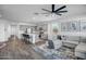 Open-concept living space with tile floors, a modern ceiling fan, and direct access to the kitchen area at 1482 W Gloucester W Rd, San Tan Valley, AZ 85143