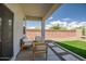 Covered patio with outdoor seating, artificial grass, and views of the backyard at 1482 W Gloucester W Rd, San Tan Valley, AZ 85143