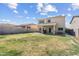 Expansive backyard features a well-maintained lawn, perfect for outdoor gatherings and recreation at 1518 W Crape Rd, San Tan Valley, AZ 85140