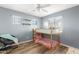 bedroom featuring wood-look floors, ceiling fan, and bunk beds at 1518 W Crape Rd, San Tan Valley, AZ 85140