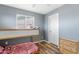 bedroom featuring wood-look floors, ceiling fan, and bunk beds at 1518 W Crape Rd, San Tan Valley, AZ 85140