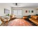 Inviting living room with hardwood floors, a plush sofa, and ample natural light, creating a cozy atmosphere at 1518 W Crape Rd, San Tan Valley, AZ 85140