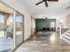 Open concept living and dining area features luxury vinyl plank flooring and a sliding glass door to the backyard at 1518 W Crape Rd, San Tan Valley, AZ 85140
