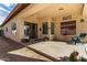 Comfortable covered backyard patio perfect for enjoying the outdoors and entertaining at 15246 N 138Th Ln, Surprise, AZ 85379