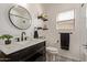 Stylish bathroom with a decorative tile floor and a floating shelf at 15246 N 138Th Ln, Surprise, AZ 85379