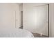 Simple bedroom with carpet, sliding closet doors, and a peek into another room at 15246 N 138Th Ln, Surprise, AZ 85379