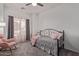 Cozy bedroom with plush carpet, soft gray walls, a cute daybed, and natural light at 15246 N 138Th Ln, Surprise, AZ 85379