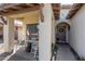 Inviting covered front porch with rocking chairs and desert landscaping leading to the front door at 15246 N 138Th Ln, Surprise, AZ 85379