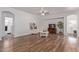 Open-concept living room with ceiling fan, and hardwood flooring at 15246 N 138Th Ln, Surprise, AZ 85379