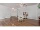 Spacious living room features hardwood floors and a ceiling fan at 15246 N 138Th Ln, Surprise, AZ 85379