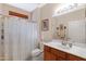 Bathroom featuring a shower/tub combo, a toilet and a sink with wood cabinets at 16450 E Avenue Of The Fountain -- # 47, Fountain Hills, AZ 85268