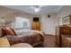 Bright bedroom with hardwood floors, ceiling fan, window with blinds and neutral wall color at 16450 E Avenue Of The Fountain -- # 47, Fountain Hills, AZ 85268