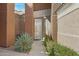 The welcoming front porch features a beautiful agave plant and flowering bushes alongside the walkway at 16450 E Avenue Of The Fountain -- # 47, Fountain Hills, AZ 85268