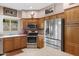 Spacious kitchen boasts stainless steel appliances, oak cabinetry and an island with tile flooring at 16450 E Avenue Of The Fountain -- # 47, Fountain Hills, AZ 85268