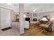 Open concept living room with hardwood flooring, a fireplace, comfortable seating, and access to other rooms at 16450 E Avenue Of The Fountain -- # 47, Fountain Hills, AZ 85268