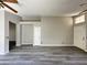 Inviting living area with neutral paint, wood floors, and a front door at 1704 E Redfield Rd, Gilbert, AZ 85234