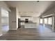 Open concept living space with a kitchen island and stainless steel appliances at 1704 E Redfield Rd, Gilbert, AZ 85234