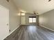 Inviting living area with neutral paint, wood floors, and a front door at 1704 E Redfield Rd, Gilbert, AZ 85234