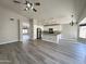 Open concept living space with a kitchen island and stainless steel appliances at 1704 E Redfield Rd, Gilbert, AZ 85234