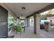 Inviting covered patio with stylish seating and view of the pool and hot tub at 17211 N 58Th St, Scottsdale, AZ 85254