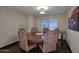 Elegant dining room with hardwood floors, a round table, and stylish chairs at 17211 N 58Th St, Scottsdale, AZ 85254