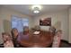Dining room with hardwood floors, a round table, and stylish chairs at 17211 N 58Th St, Scottsdale, AZ 85254