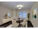 Dining room with hardwood floors, an oval table, and a stylish light fixture at 17211 N 58Th St, Scottsdale, AZ 85254