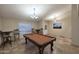 Well-lit game room with a pool table and comfortable bar seating at 17211 N 58Th St, Scottsdale, AZ 85254