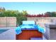 Relaxing hot tub with privacy wall and lush landscaping, creating a tranquil retreat at 17211 N 58Th St, Scottsdale, AZ 85254
