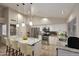 Bright kitchen featuring a center island, stainless steel appliances, and stone countertops at 17211 N 58Th St, Scottsdale, AZ 85254