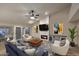Bright living room with fireplace, modern furniture, and lots of windows at 17211 N 58Th St, Scottsdale, AZ 85254