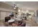 Open concept living room and kitchen, featuring a pool table and cozy seating at 17211 N 58Th St, Scottsdale, AZ 85254