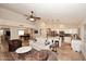 Open floor plan with travertine floors, living room, and kitchen at 17211 N 58Th St, Scottsdale, AZ 85254