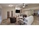 Living room with fireplace, ceiling fan, travertine floors and stylish decor at 17211 N 58Th St, Scottsdale, AZ 85254