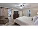 Well-lit main bedroom showcases a sliding barn door, walk-in closet, and wood-look flooring at 17211 N 58Th St, Scottsdale, AZ 85254