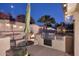 Outdoor kitchen with built-in grill and pizza oven, perfect for evening entertaining at 17211 N 58Th St, Scottsdale, AZ 85254