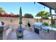 Outdoor kitchen with built-in grill and pizza oven, perfect for al fresco dining at 17211 N 58Th St, Scottsdale, AZ 85254