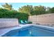 Sparkling pool with lush greenery, lounge chairs, and a charming patio area for outdoor relaxation at 17211 N 58Th St, Scottsdale, AZ 85254