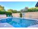 Beautiful pool area with lounge chairs, manicured landscaping, and a basketball hoop for recreation at 17211 N 58Th St, Scottsdale, AZ 85254