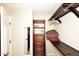 Walk-in closet boasts custom wood shelving and storage space at 17211 N 58Th St, Scottsdale, AZ 85254