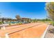 Community bocce ball court offers a fun and social outdoor activity at 17320 W Daley Ln, Surprise, AZ 85387