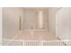 A tiled floor empty room with a baby gate, suitable for play or creative use at 17320 W Daley Ln, Surprise, AZ 85387