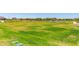 Expansive green field in a well-maintained community, perfect for outdoor activities at 17320 W Daley Ln, Surprise, AZ 85387