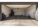 Spacious two car garage with ample storage, ready to be a versatile space for vehicles and projects at 17320 W Daley Ln, Surprise, AZ 85387