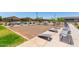 Outdoor play area with benches, providing a relaxing space for families and community members at 17320 W Daley Ln, Surprise, AZ 85387