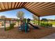 A fun-filled playground with slides, monkey bars, and swings for of all ages at 17320 W Daley Ln, Surprise, AZ 85387