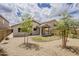 Expansive backyard featuring desert landscaping and a covered patio at 1744 W Brookwood Ct, Phoenix, AZ 85045