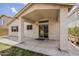 Covered patio featuring a door and window, offering great views of the backyard at 1744 W Brookwood Ct, Phoenix, AZ 85045