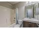 Bathroom with a tub and shower combination and a modern vanity with a sink at 1744 W Brookwood Ct, Phoenix, AZ 85045