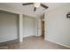 Tile bedroom with walk in closet, ceiling fan, and connected bathroom at 1744 W Brookwood Ct, Phoenix, AZ 85045